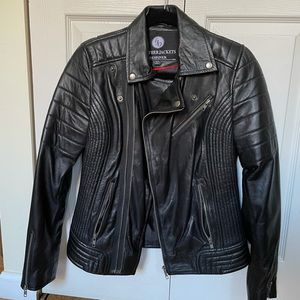 Black leather jacket with quilted shoulders and sides.